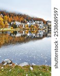 Autumn landscape and city on the lake in st. Moritz