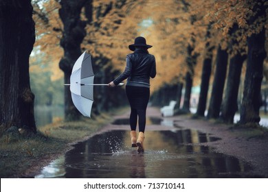 Autumn Landscape City Woman Umbrella Rain Puddles Of Yellow Trees