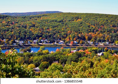 Autumn Landscape In Connecticut River Valley. Red And Yellow Leaves Of Maples Trees Sprinkle The Hills Of New Hampshire And The Green Mountains Of Vermont. Forest Still Mostly Green Or Changing Colors