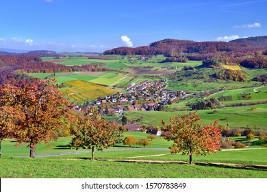 Autumn landscape, in front cherry trees in autumn colors, Wintersingen, Canton of Basel-Landschaft, Switzerland - Shutterstock ID 1570783849