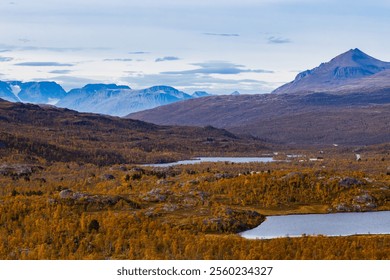 Autumn landscape of Kilpisjarvi, Finland, showcasing colorful foliage, serene lakes, and majestic mountains. - Powered by Shutterstock