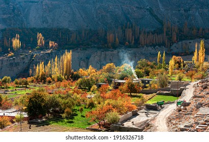 autumn landscape photos with snow mountains and lush green valleys of hunza , gilgit Baltistan  - Shutterstock ID 1916326718