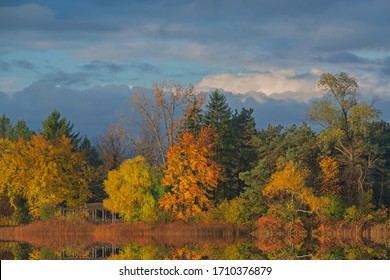 Autumn Landscape At Sunrise Of Whitford Lake With Mirrored Reflections In Calm Water, Fort Custer State Park, Michigan, USA