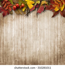 Autumn Leaves Border On Vintage Wooden Background