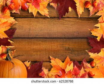 Autumn leaves frame with wood background