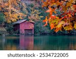 Autumn leaves and a weathered boathouse offer a splash of color at DeSoto Falls, Nov. 4, 2017 in Mentone, Alabama. The area features a 104-foot waterfall and is part of DeSoto State Park.