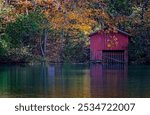 Autumn leaves and a weathered boathouse offer a splash of color at DeSoto Falls, Nov. 4, 2017 in Mentone, Alabama. The area features a 104-foot waterfall and is part of DeSoto State Park.