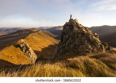 Autumn Light Over Auvergne, Puy De Dôme, France. Photo Of Hiker Looking The Mountains.