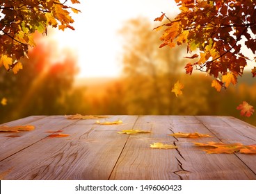 Autumn maple leaves on wooden  table.Falling leaves natural background. - Shutterstock ID 1496060423