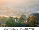 Autumn misty morning sunrises near Alfriston village nestled in the cuckmere valley of the south downs East Sussex south east England UK