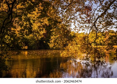 Autumn mood with colourful leaves by the lake