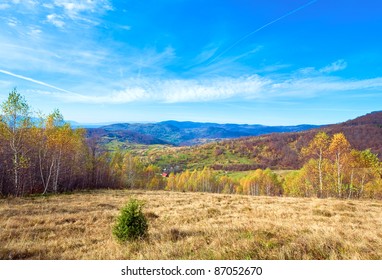 Autumn Mountain Country Landscape With Village ,birch Trees And Vapour Trail In Sky(Carpathian, Ukraine).