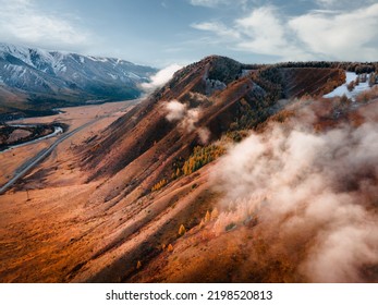 Autumn Mountains With Clouds At Sunset. Altai Mountains, Siberia, Russia. Beautiful Autumn Landscape