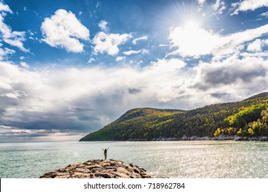 Autumn Nature Background Canadian Landscape In Quebec, Canada. Fall Season St Lawrence River In Charlevoix Region, North America. Tourist With Arms Up Open In Freedom Happy Of Travel Holidays.