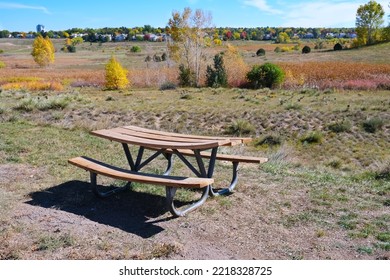 Autumn Nature Landscape Open Space View With A Wooden Outdoor Picnic Table Along A Hiking Trail Photo With Copy Space. Fall Season Or Active Lifestyle Concept. 