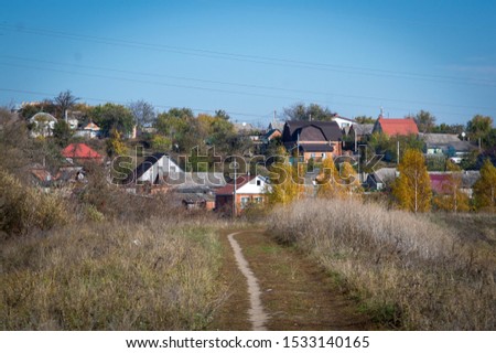 autumn nature and urban houses on the background
