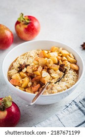 Autumn Oatmeal With Caramelized Apple And Cinnamon In White Bowl. Winter Cozy Recipe. Healthy Comfort Food.