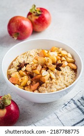 Autumn Oatmeal With Caramelized Apple And Cinnamon In White Bowl. Winter Cozy Recipe. Healthy Comfort Food.