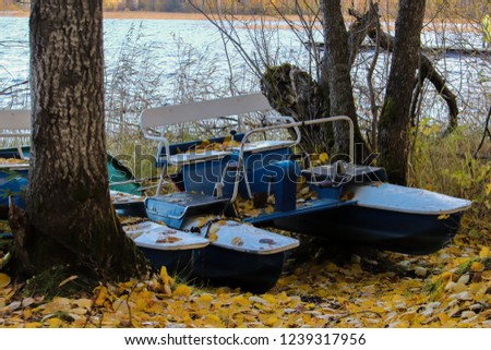 Autumn on the lake Smerge near Arkhangelsk. Pleasure catamarans pulled out of the water. Autumn sadness.