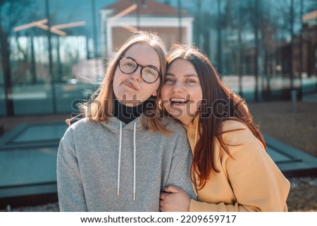 Similar – Image, Stock Photo Twin sisters look around in an alleyway