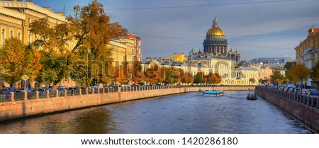 Autumn panorama of the embankment of the Moika river and St. Isaac's Cathedral in Saint-Petersburg