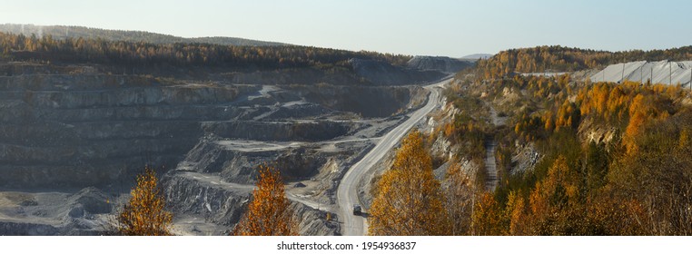 Autumn panorama of a quarry where is mined the slate and limestone.