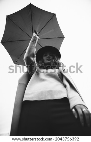 Similar – Blonde thin woman with hat and sunglasses visiting the city during the day.