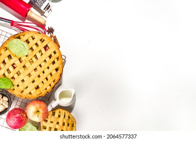 Autumn Pie And Cakes Baking Background. Sweet Apple, Pecan, Pumpkin Squash Pies With Baking Ingredients And Utensils, White Table Background Top View Copy Space