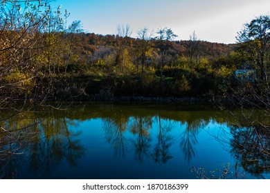 Autumn Pond Among The Forest In The Mountains Of The Western Caucasus On A Sunny Day. Not Far From The Village Of Mirny In The Seversky District