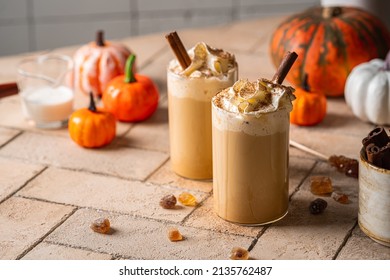 Autumn Pumpkin Spice Latte With Whipped Cream And Cinnamon On Light Background