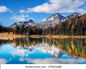 Autumn reflections on the lake Silvaplana, Engadine Saint Moritz, Switzerland