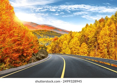 autumn road landscape in beautiful nature travel. autumn colors in mountain road scenery. autumn landscape on the highway in colorful forest. nature trip in fall. highway landscape on fall season.