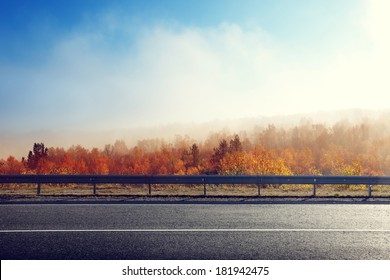 Autumn Road In Sunset Time