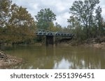 Autumn scenery and a bridge view over the Little Missouri River, or Little Mo running from the Ouachita Mountains of southwest Arkansas, USA