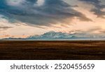 Autumn scenery from Sailimu Lake Scenic Area in Xinjiang, China. Magnificent mountains, blue lakes, snowy mountains in the distance and ever-changing weather.