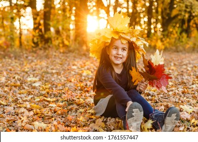 Autumn season leisure. Atmosphere of autumn. Adorable smiling schoolgirl autumn foliage background. Good mood. Happy child. Welcome october. United with nature. Little child walk in autumn park.