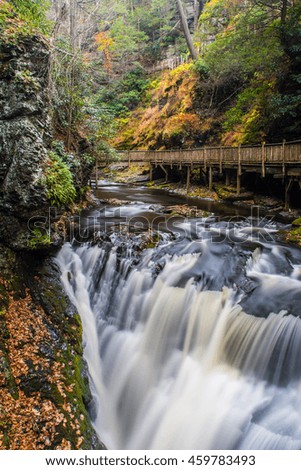 An autumn setting overlooking the main waterfall of Bushkill Falls, often referred to locally as 