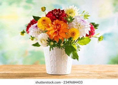 Autumn still life with garden flowers. Beautiful autumnal bouquet in vase on wooden table. Colorful dahlia and chrysanthemum. - Powered by Shutterstock