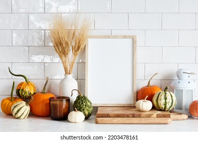 Autumn Still Life. Picture Frame Template, Harvest Of Pumpkins, Dry Wheat On White Table In Scandinavian Kitchen Interior. Autumn Fall, Harvest, Thanksgiving Holiday Concept.