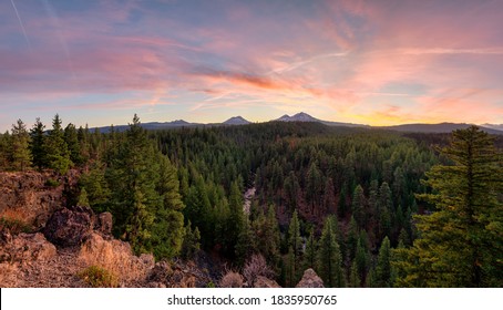 The Autumn Sun Sets Over Three Sisters In The Cascade Mountains From Bend, Oregon