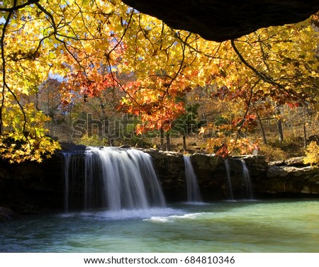 Autumn surrounds Falling Water Falls with spectacular fall colors on the leaves. Ozark National Forest, Arkansas