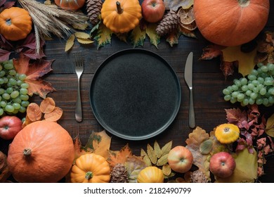 Autumn Table Place Setting With Drying Leaves And Pumpkins. View From Above. Happy Thanksgiving Day.