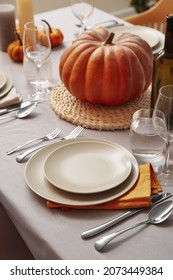 Autumn Table Setting With Fresh Pumpkin In Room