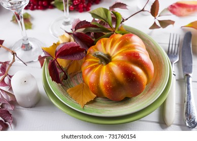 Autumn table setting with pumpkins.