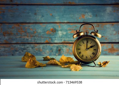 Autumn Time Change, Autumn Leaves and Alarm Clock.
