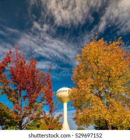 Autumn Trees And Dramatic Clouds Over The Meridian Water Tower