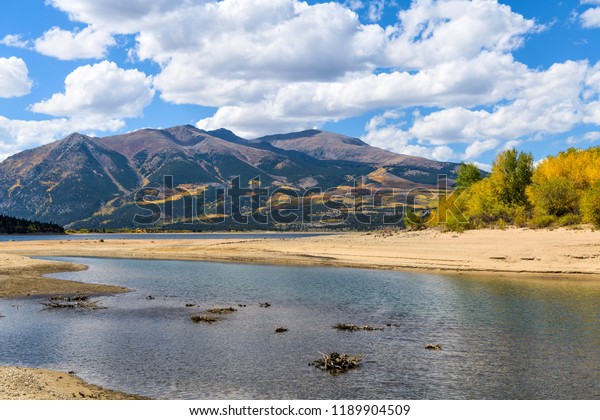 Autumn at Twin Lakes - A sunny autumn day view of\
Twin Lakes at base of two highest peaks, Mount Elbert and Mount\
Massive, of Rocky Mountains of North America. Leadville, Colorado,\
USA.