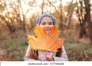 Autumn Vibes, Hello Autumn Concept. Stylish 7 Years Old Girl Walking In The Empty Park Among Golden Trees, Social Distance, Sunny Weekend, Beautiful Nature Outside