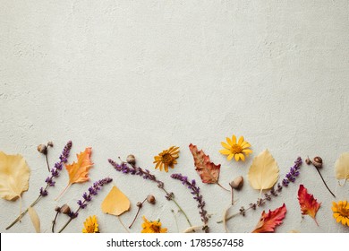 Autumn Vibes. Template Made Of Dried Leaves And Flowers On Stone Background. Seasonal Background, Fall Concept, Thanksgiving Day Composition. Flat Lay, Copy Space