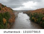Autumn view of the Connecticut River from a tall bridge as fog lifts after the rain.